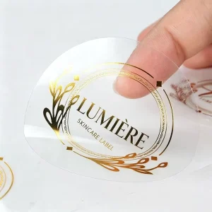 Custom Waterproof Self Adhesive Clear Gold Foil Stamping Logo Sticker Printing Transparent Label Sticker