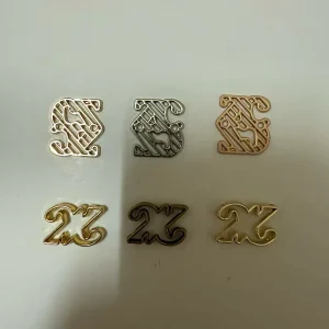 Eco Friendly Anti Corrosion Custom Hollow Alloy Label Cutout Letter Metal Hardware for Socks Gloves Hats Handbags